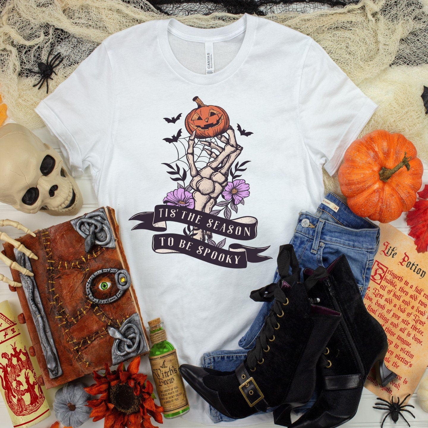 Spooky Season T-Shirt: Skeleton Hand & Pumpkin Halloween Tee