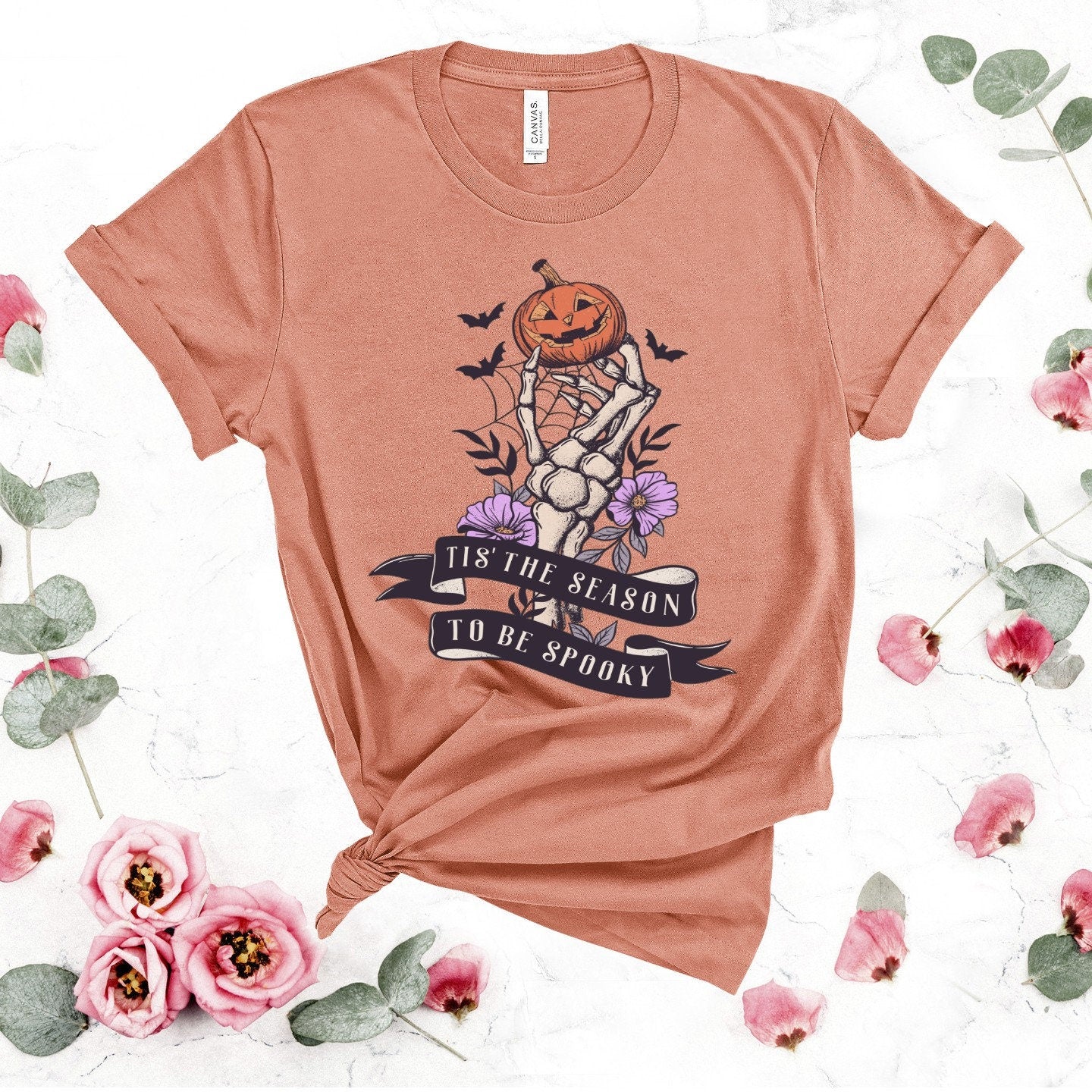 Spooky Season T-Shirt: Skeleton Hand & Pumpkin Halloween Tee
